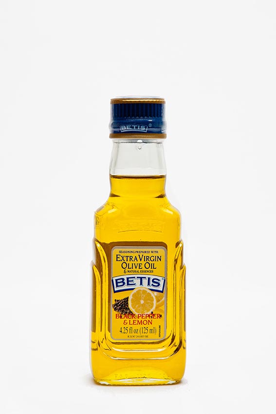 Caja de 24 botellas vidrio de 125 ml de aceite de oliva virgen extra BETIS y esencia natural de pimienta negra y limón